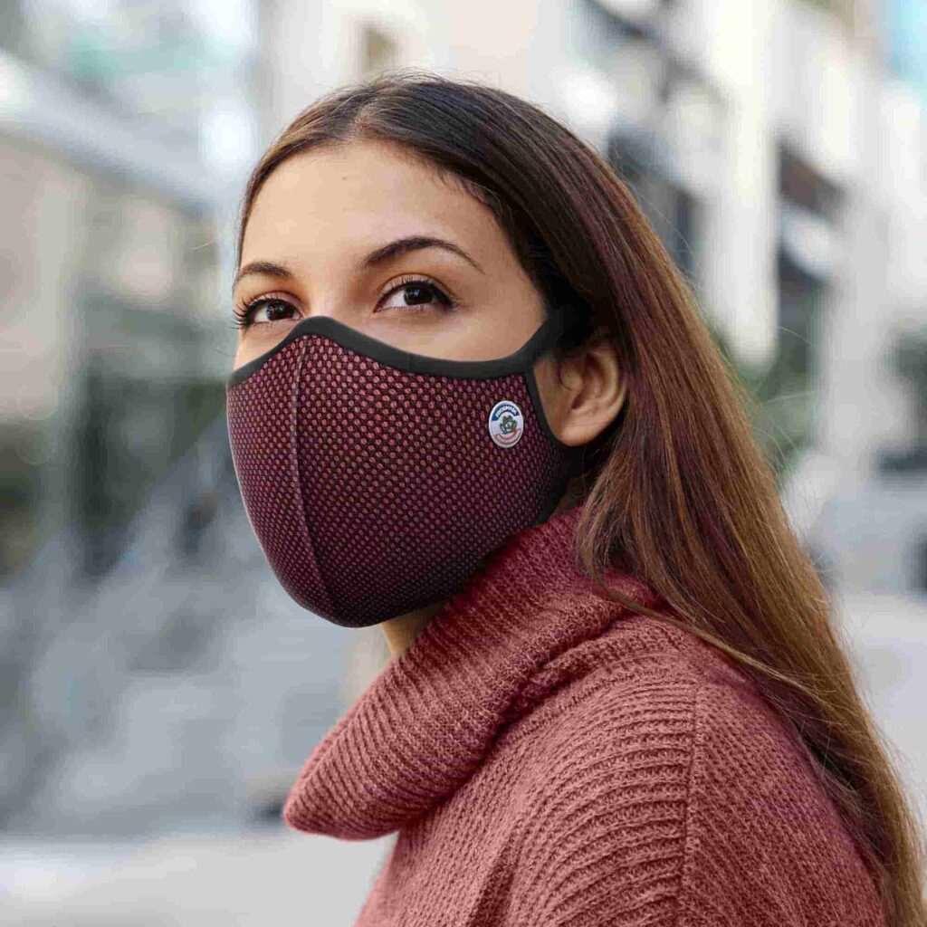 Girl wearing a burgundy Frogmask for shooting sports
